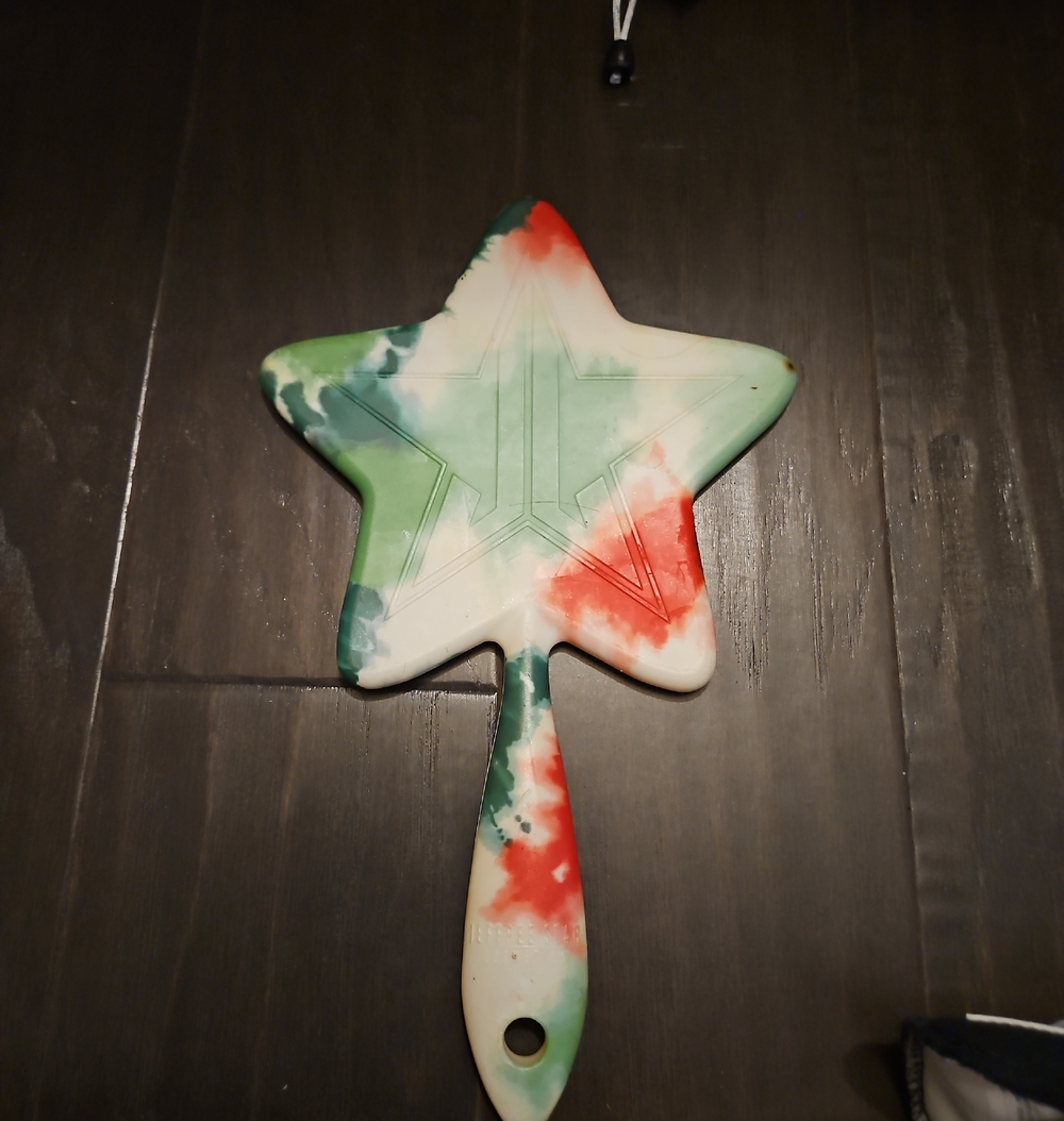 Jeffree Star star hand mirror in green, red, white swirl